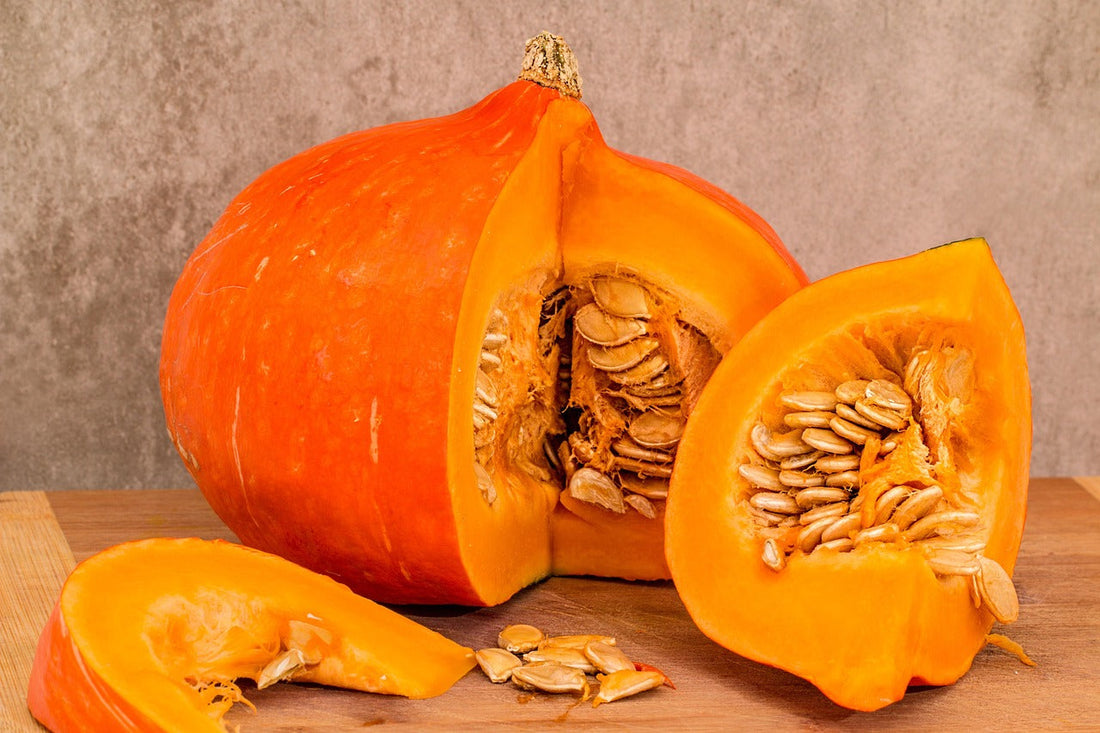 A Freshly Cut Open Pumpkin and Seeds